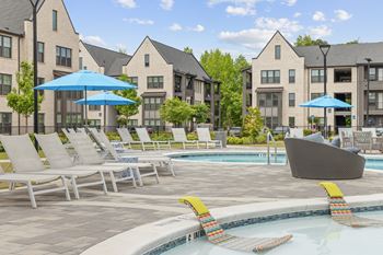 Resort-style pool with tanning ledges